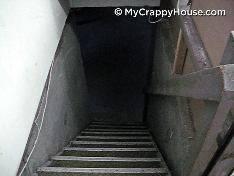 Looking down creepy basement stairs