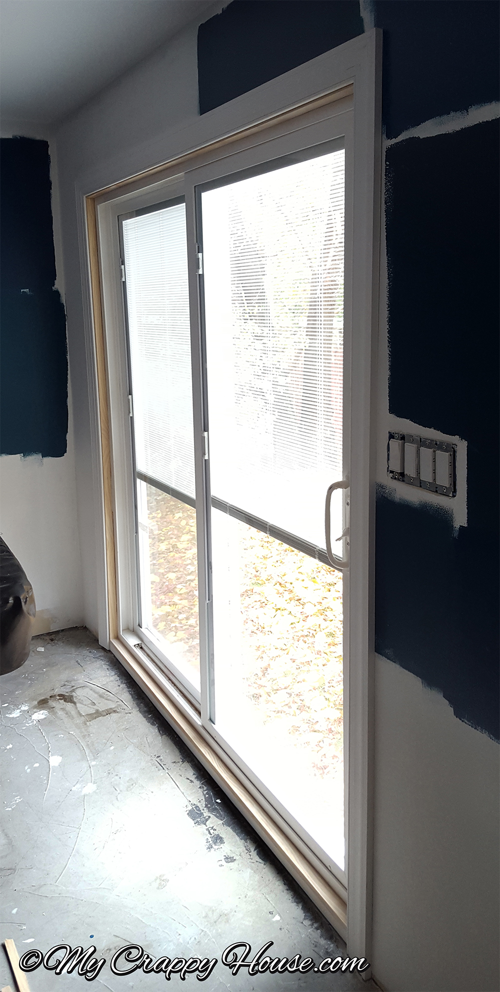 Sliding glass door with trim