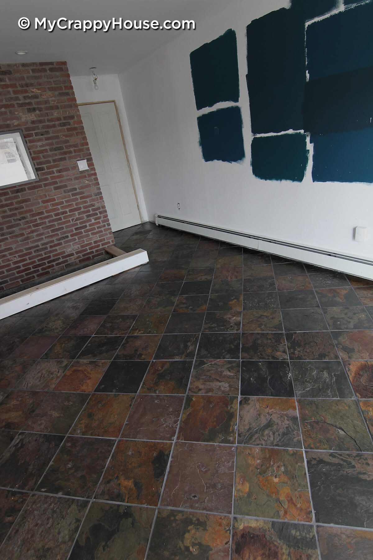 Dining room with finished slate tile floor installed
