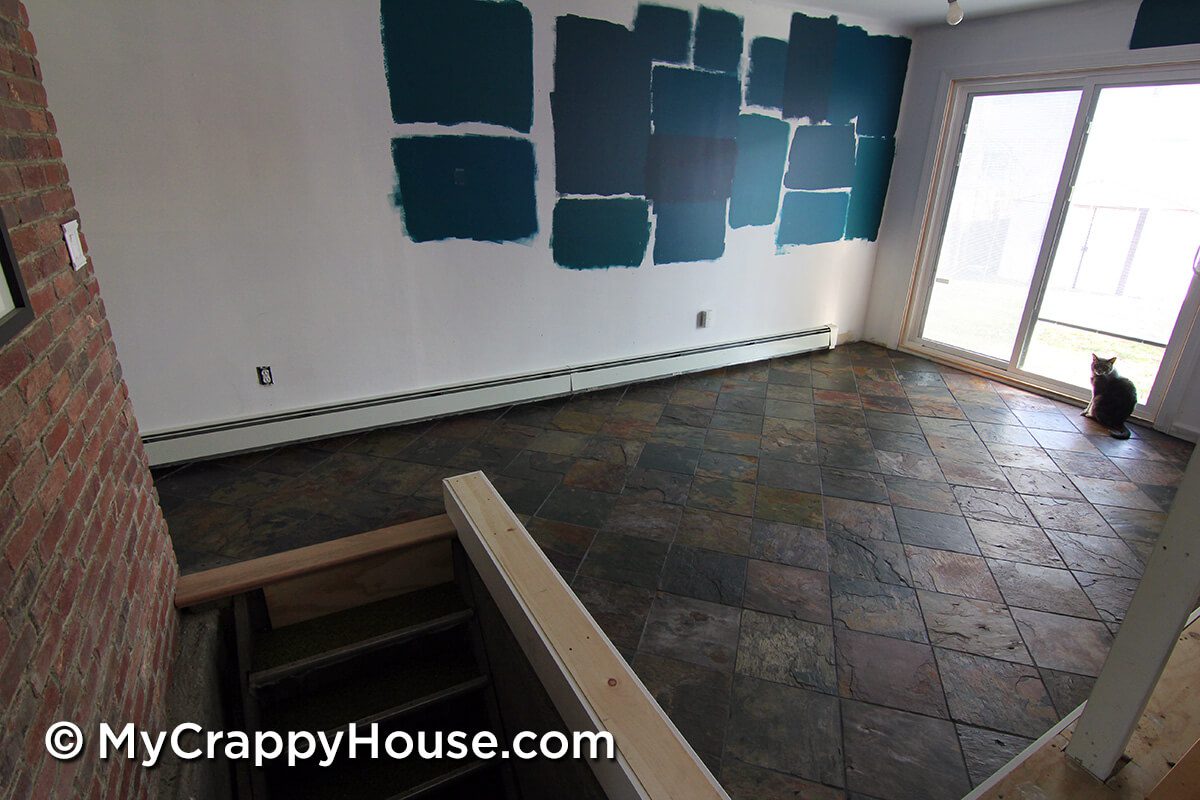 Dining room with finished slate tile floor installed