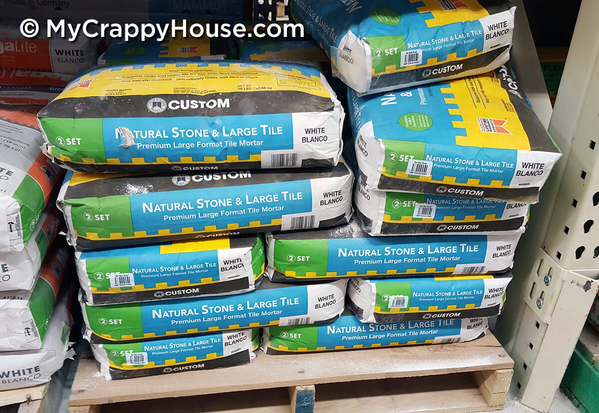 Bags of mortar on pallet for large tiles