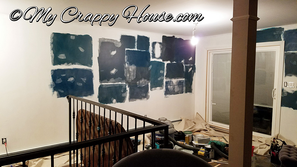 peacock blue paint swatches with spackling all over to prep dining room for painting