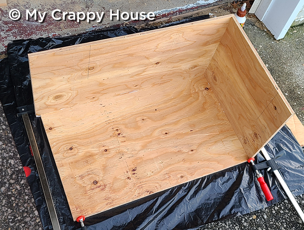 gluing cat house box together