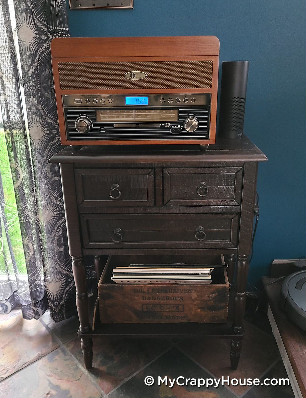 Wooden cabinet with record player on top