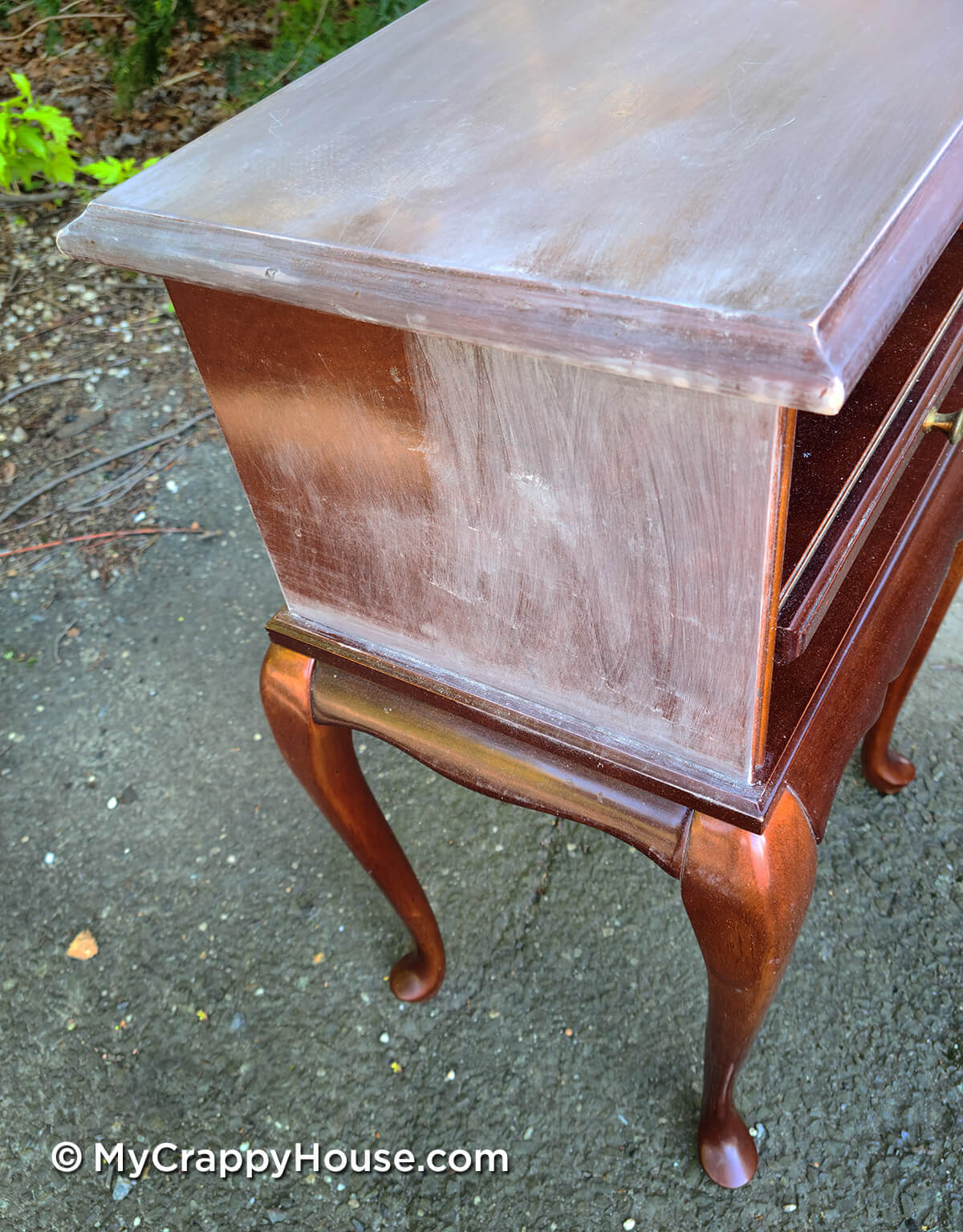 Scuffing factory finish on little side table