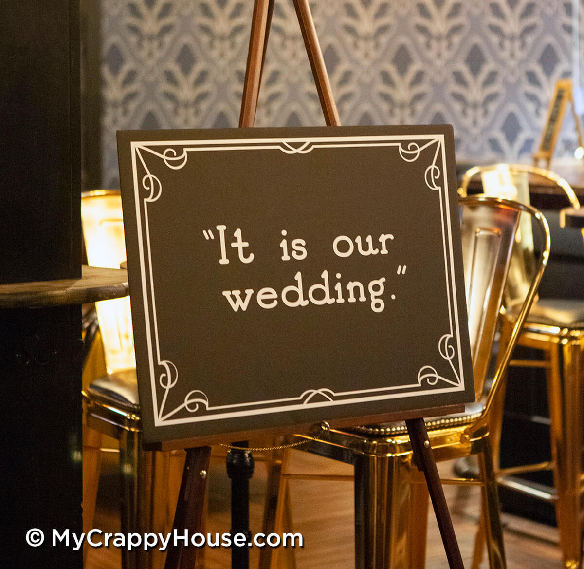 a 1920s style sign saying "it is our wedding"