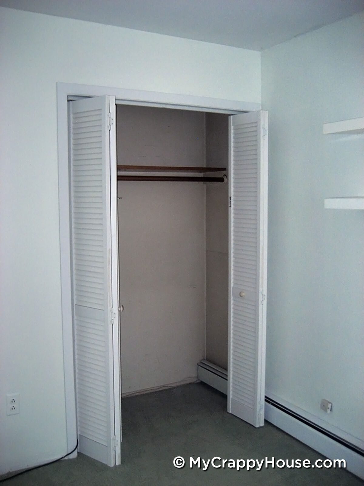 Empty closet with bifold doors