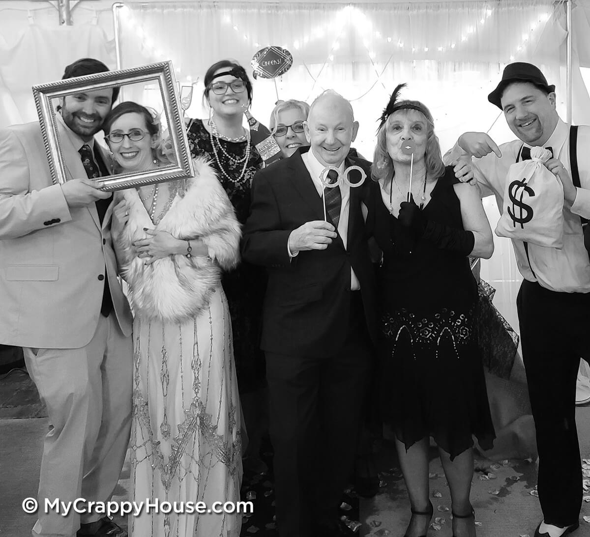1920s theme wedding group picture with props