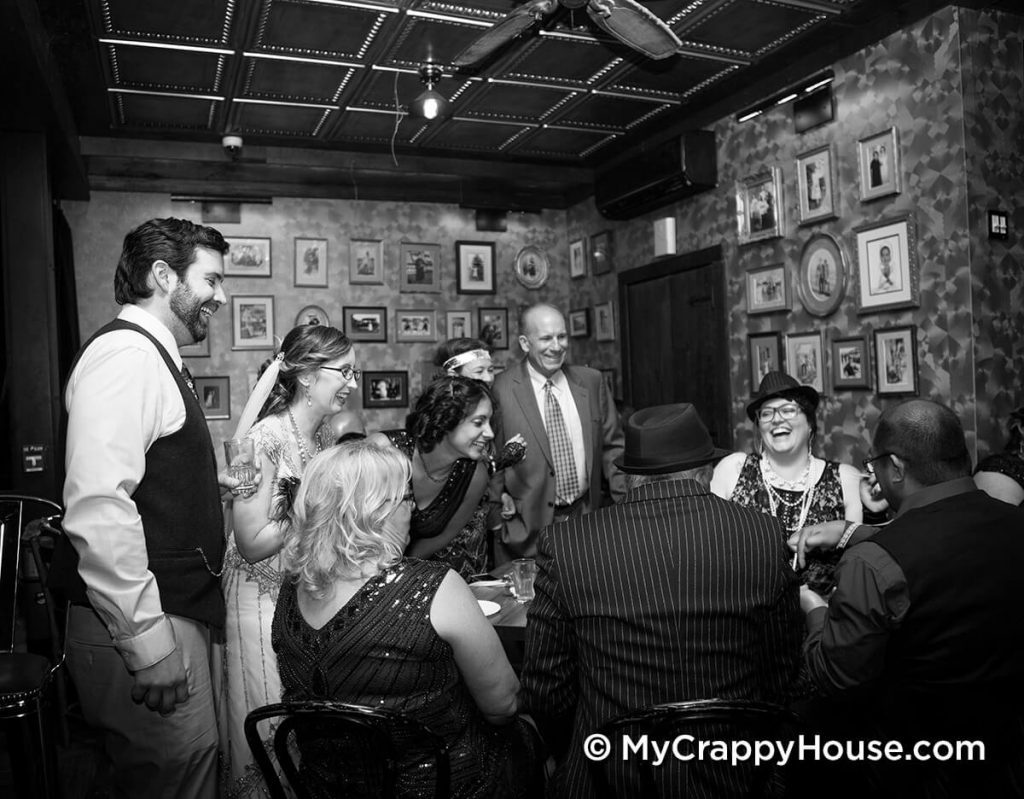 1920s speakeasy wedding group laughing