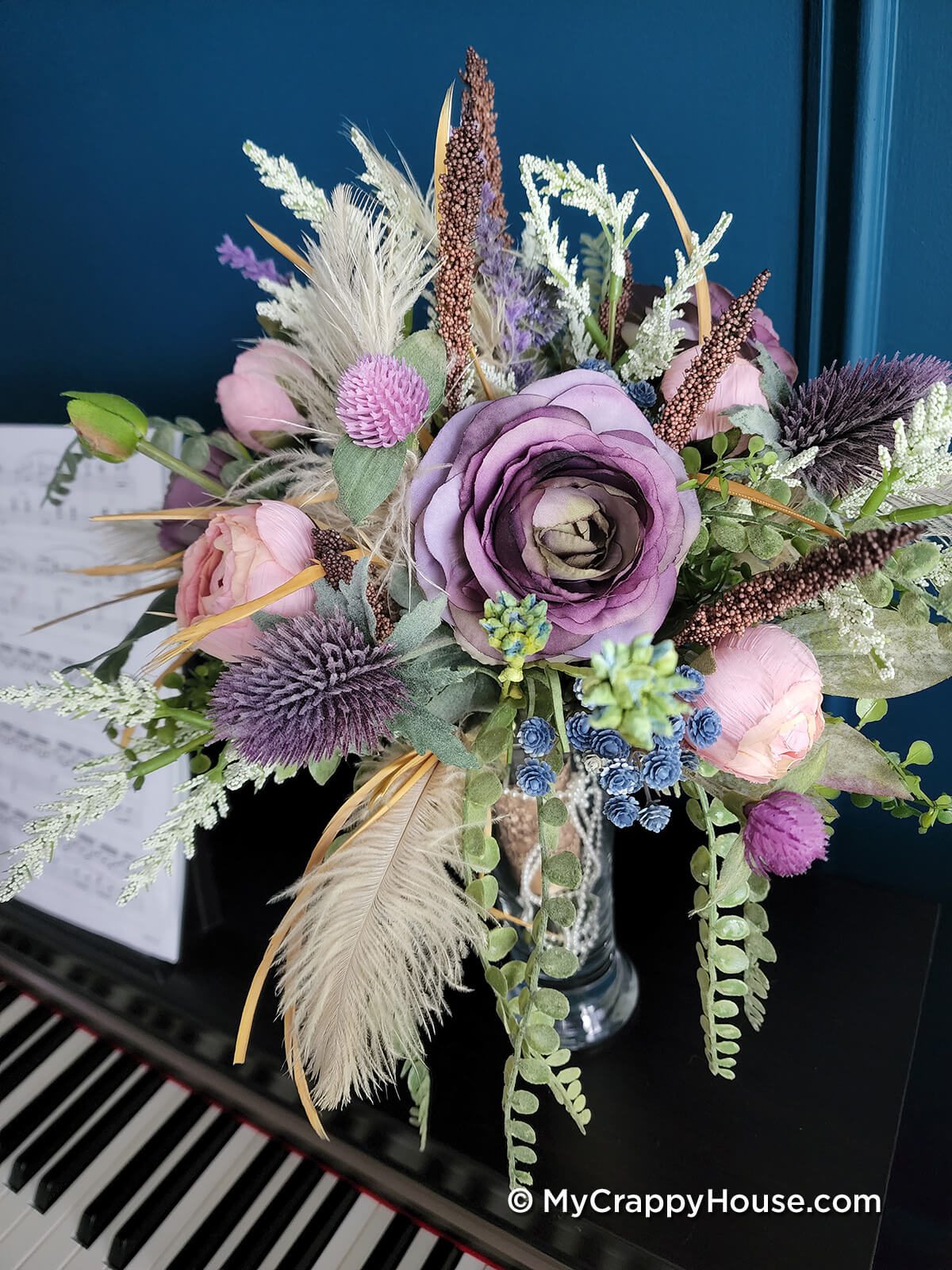 1920s wedding bouquet in vase on piano