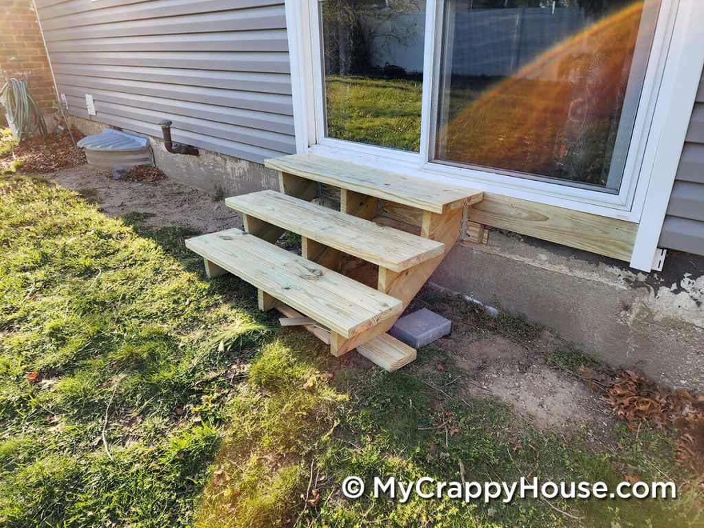 Stairs below sliding glass doors